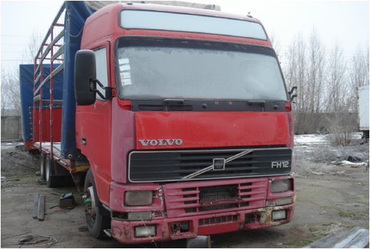 Автомобіль VOLVO FH 12 бортовий - С, державний номер АХ 1253 СК, рік випуску 1998, об'єм двигуна 12130; причіп бортовий-Е ORTHAUS AF OPA 18T, державний номер АХ 9254 ХТ, рік випуску 1996.